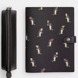 Coach Boxed Notebook And Pencil Case Set
With Penguin Print